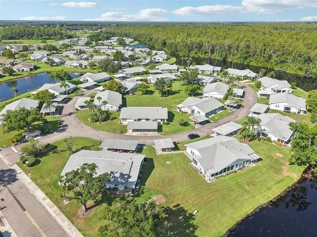 an aerial view of residential houses with outdoor space