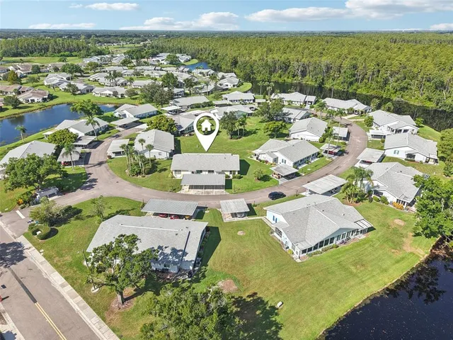 an aerial view of residential houses with outdoor space