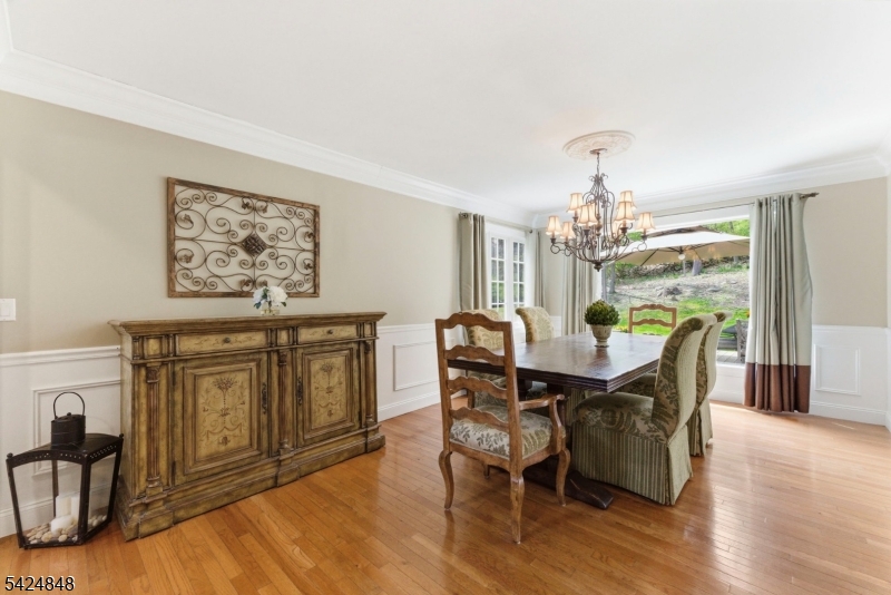 18 Valhalla Road Montville, NJ 07045 - Photo 13 of 33 a view of a dining room with furniture a chandelier and wooden floor
