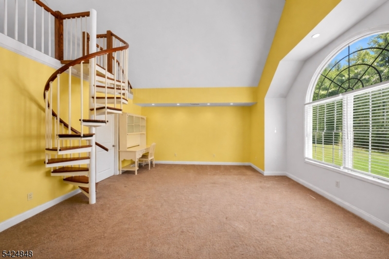 18 Valhalla Road Montville, NJ 07045 - Photo 14 of 33 a view of an empty room with stairs and a floor to ceiling window