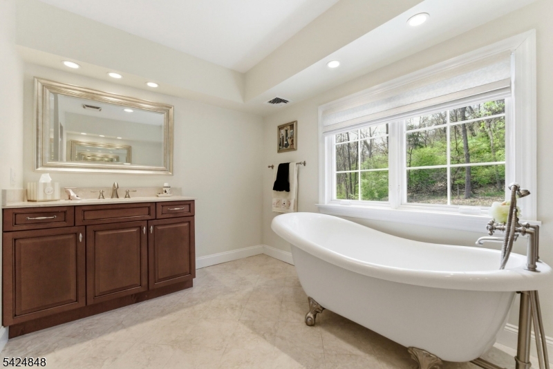 18 Valhalla Road Montville, NJ 07045 - Photo 18 of 33 a bathroom with a bathtub and a sink