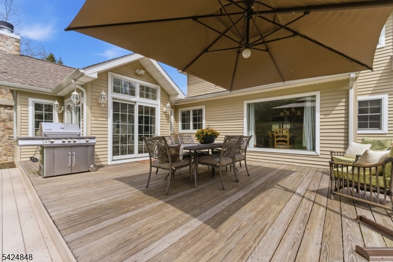 18 Valhalla Road Montville, NJ 07045 - Photo 29 of 33 a view of a roof deck with table and chairs and wooden floor
