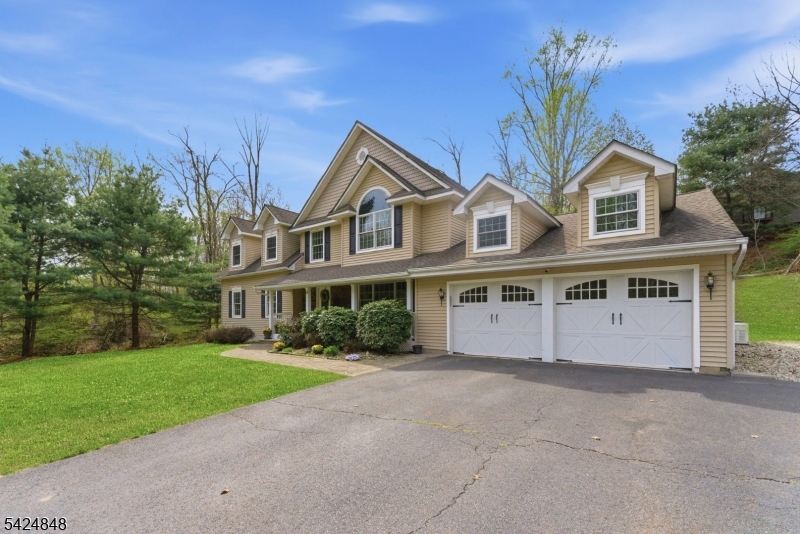 18 Valhalla Road Montville, NJ 07045 - Photo 3 of 33 a front view of house with yard and green space