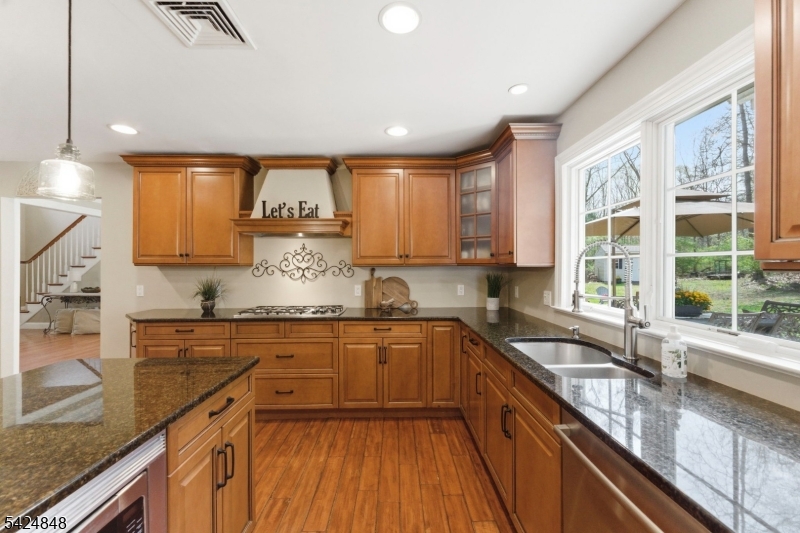 18 Valhalla Road Montville, NJ 07045 - Photo 6 of 33 a kitchen with granite countertop a sink and cabinets