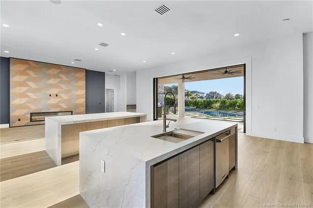 a view of a house with backyard and pool