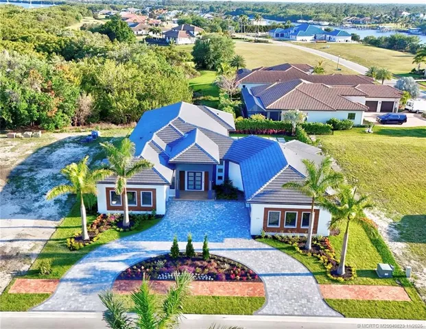 a open kitchen with stainless steel appliances granite countertop a refrigerator and a sink