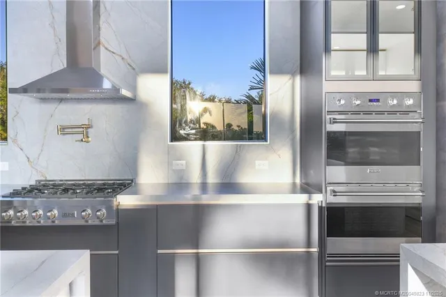 a room with pool table and a large window