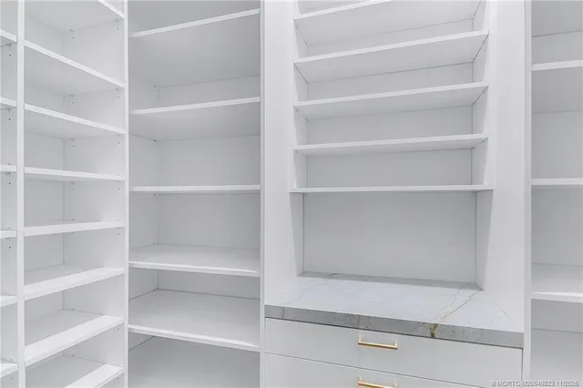 an aerial view of a house with a garden and plants