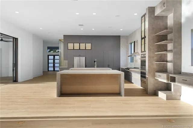 an aerial view of a house with garden space and street view