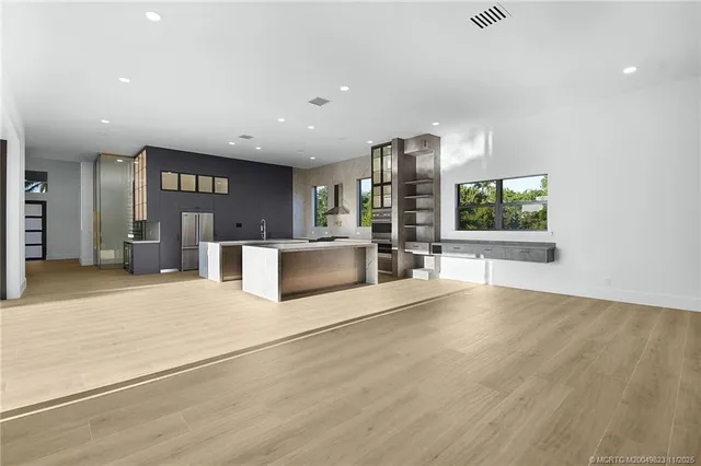 a view of a house with swimming pool and red umbrella