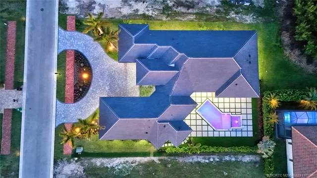 a large white kitchen with a large window