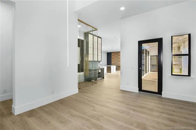 an empty room with windows and closet