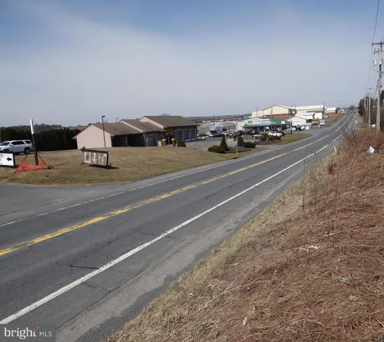 a side view of a house with a yard