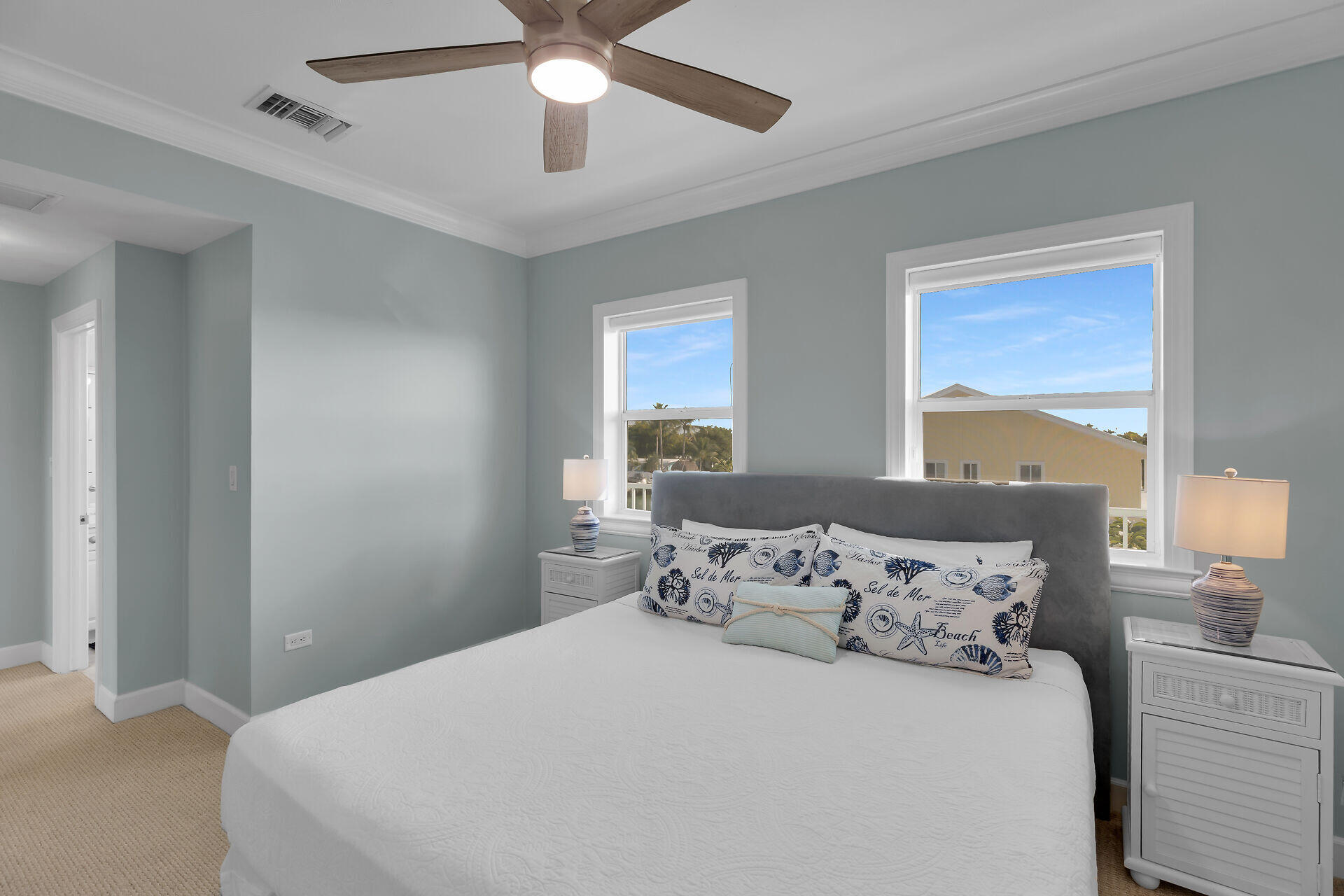 580-590 10th Street Key Colony Beach, FL 33051 - Photo 69 of 75 a bedroom with a large bed and a window