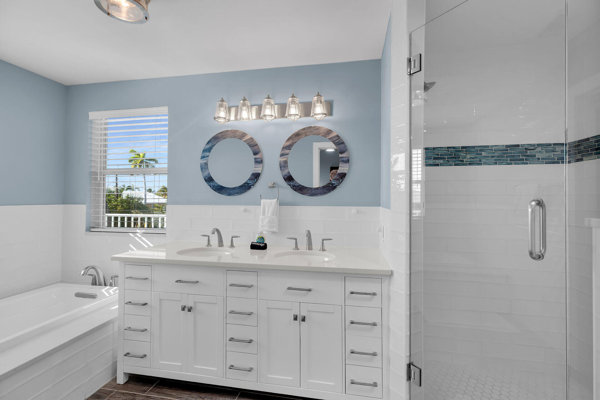 580-590 10th Street Key Colony Beach, FL 33051 - Photo 8 of 75 a bathroom with a double vanity sink mirror and bathtub