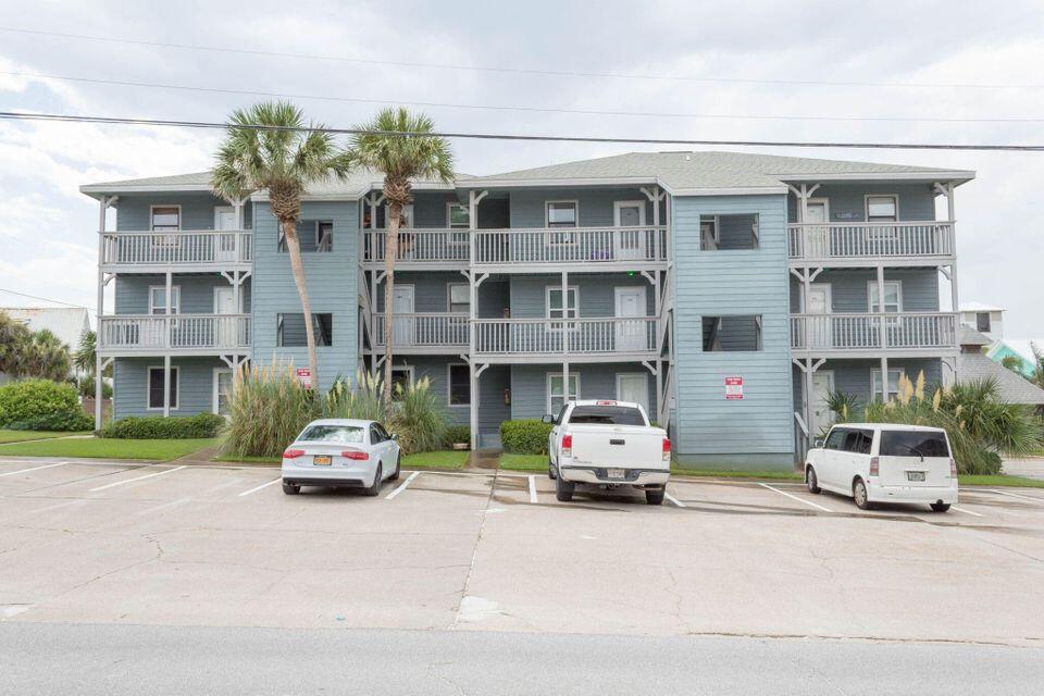 126 South Walton Lakeshore Drive, Unit 304 Inlet Beach, FL 32461 - Photo 1 of 13 a car parked in front of a building
