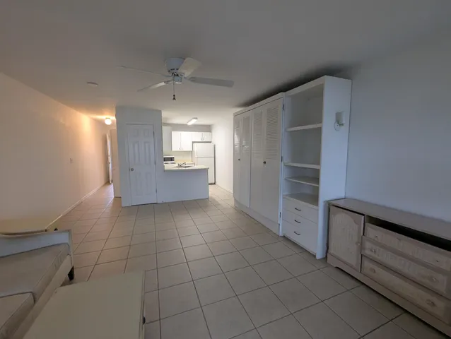 a kitchen with a refrigerator a stove a sink and a refrigerator