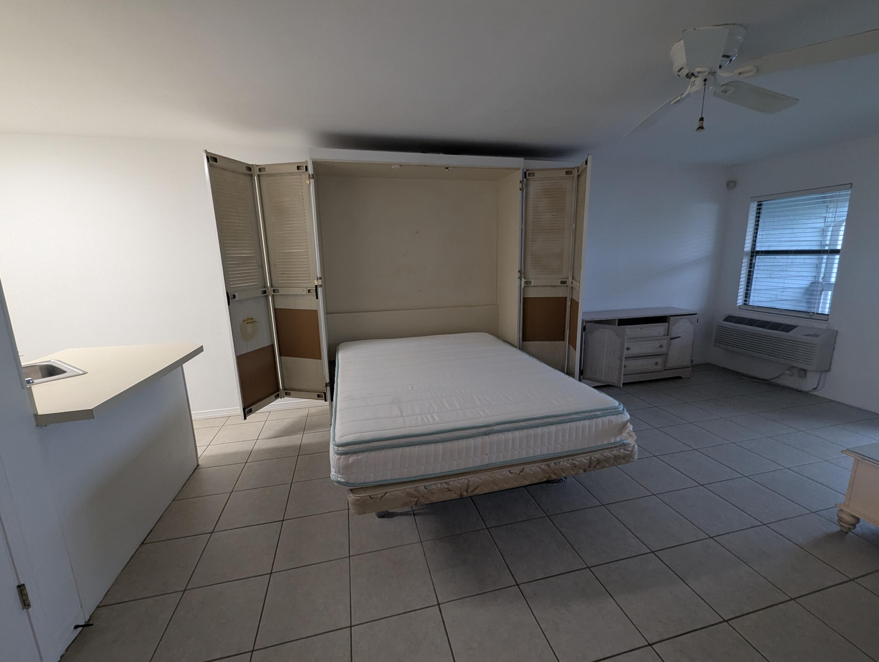 126 South Walton Lakeshore Drive, Unit 304 Inlet Beach, FL 32461 - Photo 7 of 13 a bedroom with a bed and a sink