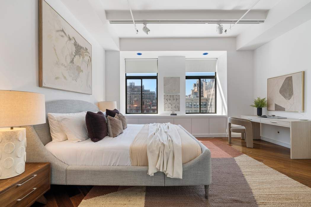 30 West 15th Street, Unit 6S Manhattan, NY 10011 - Photo 10 of 21 a bedroom with a large bed and a window