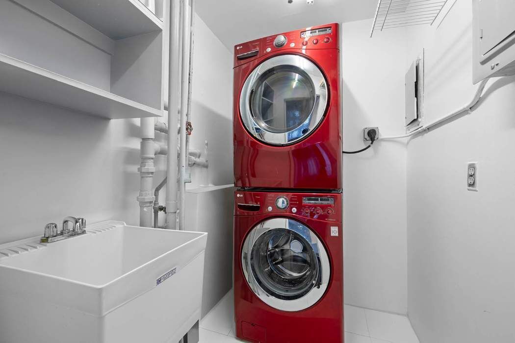 30 West 15th Street, Unit 6S Manhattan, NY 10011 - Photo 18 of 21 a utility room with dryer and washer