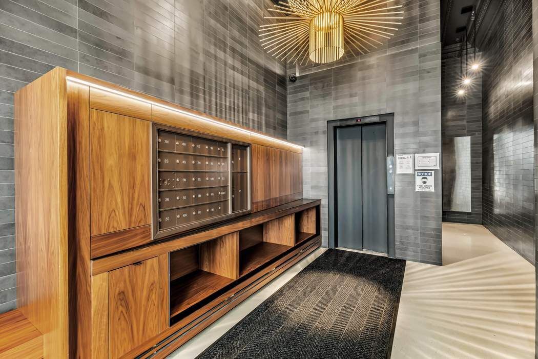 30 West 15th Street, Unit 6S Manhattan, NY 10011 - Photo 19 of 21 a view of an entryway with a wooden fence