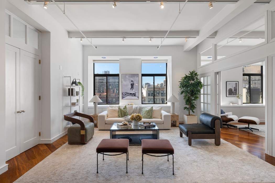 30 West 15th Street, Unit 6S Manhattan, NY 10011 - Photo 5 of 21 a living room with furniture potted plant and a large window