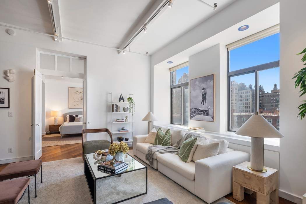 30 West 15th Street, Unit 6S Manhattan, NY 10011 - Photo 8 of 21 a living room with furniture and a large window