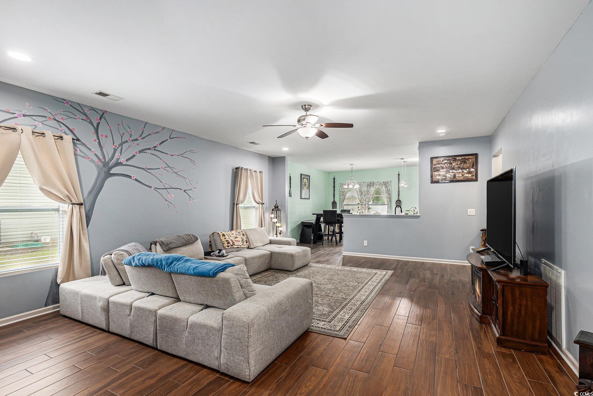 436 Cotton Grass Drive Loris, SC 29569 - Photo 3 of 33 Living area with a ceiling fan, dark wood finished floors, a chandelier, baseboards, and recessed lighting