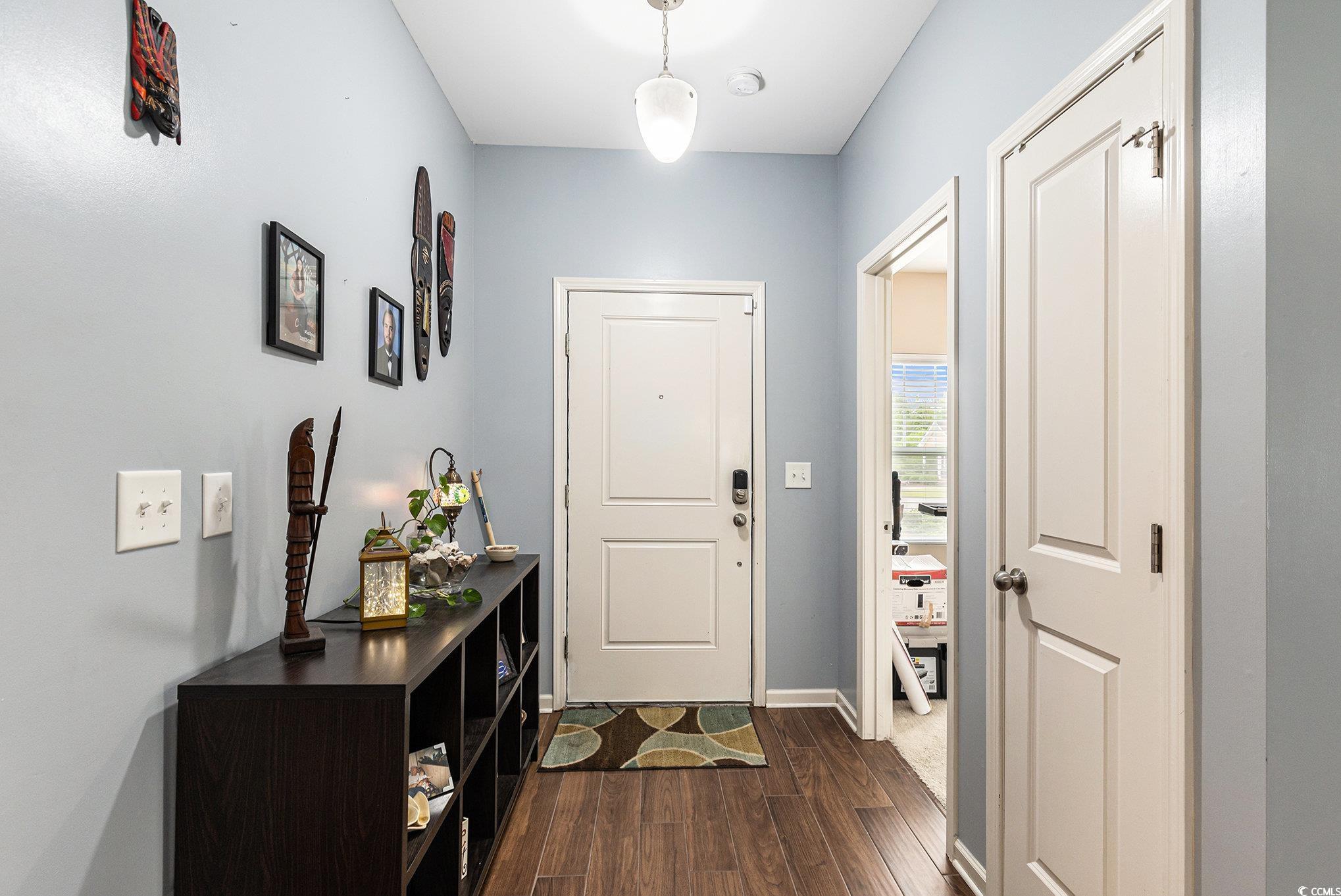436 Cotton Grass Drive Loris, SC 29569 - Photo 7 of 33 Entryway featuring dark wood-style floors and baseboards