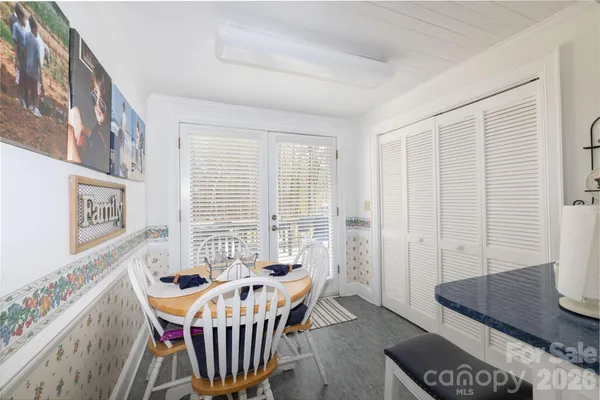 a dining room with furniture and window