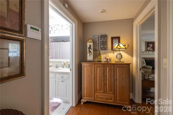 a bathroom with a sink toilet vanity and shower