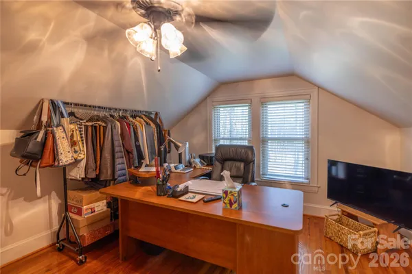 a swimming pool with outdoor seating and yard