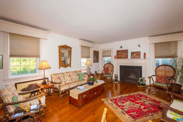 a living room with furniture and a table