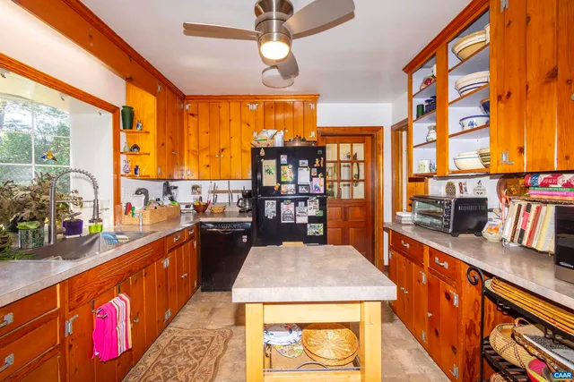 a bedroom with furniture and a book shelf