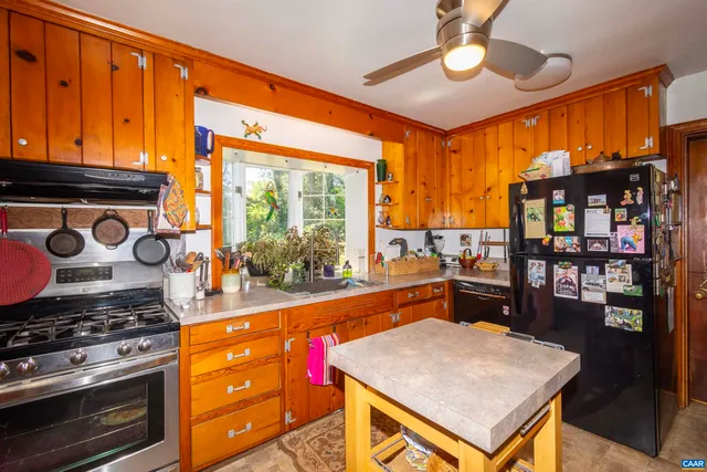 a view of a hallway with closet and wooden floor