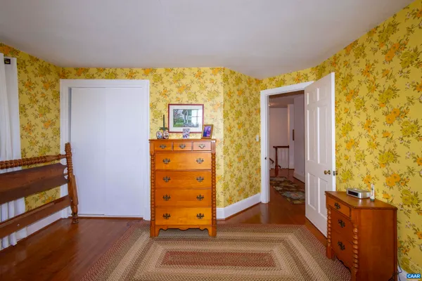 a view of a dining room with furniture wooden floor and chandelier