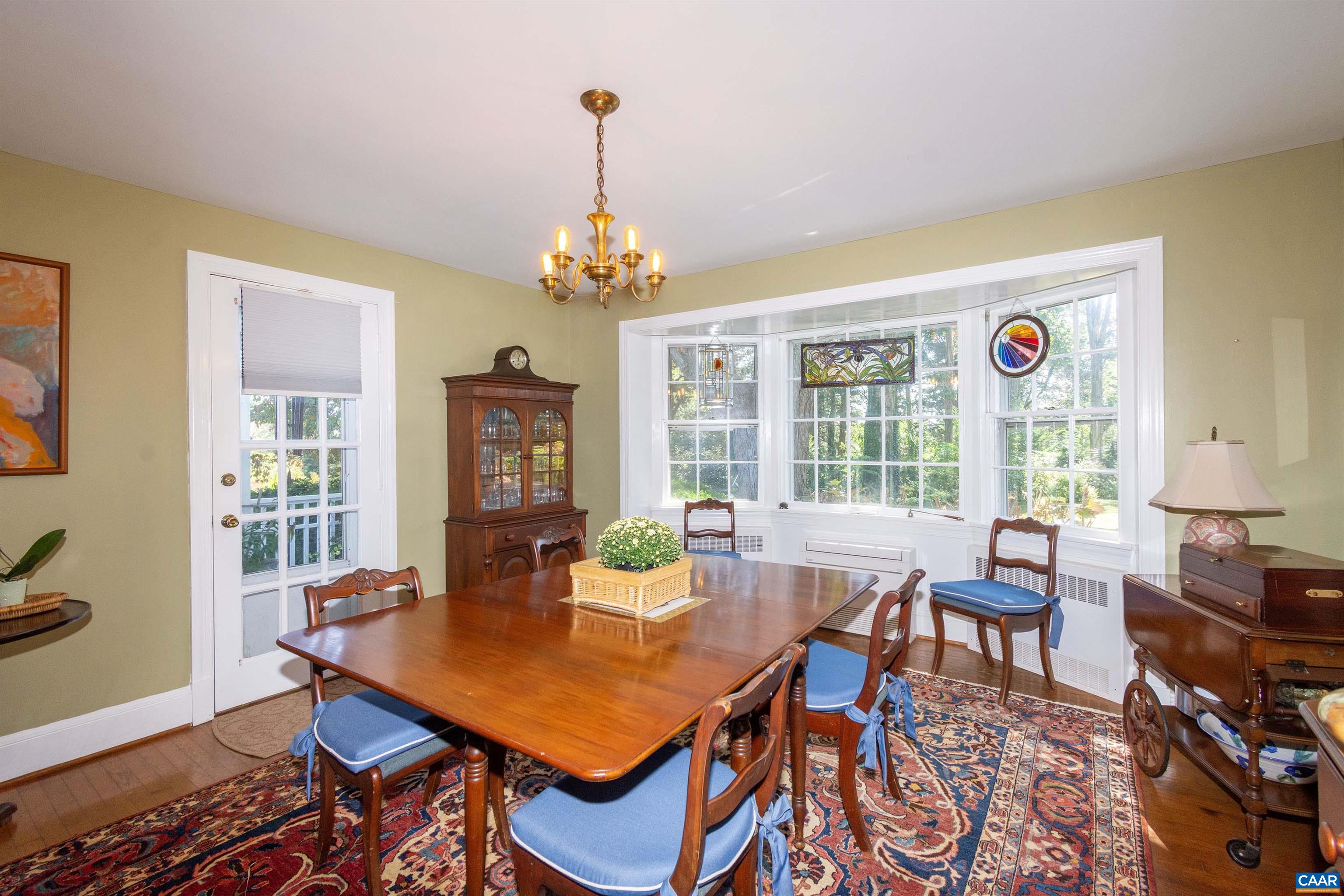 358 East Main Street Orange, VA 22960 - Photo 27 of 56 a view of a dining room with furniture wooden floor and chandelier