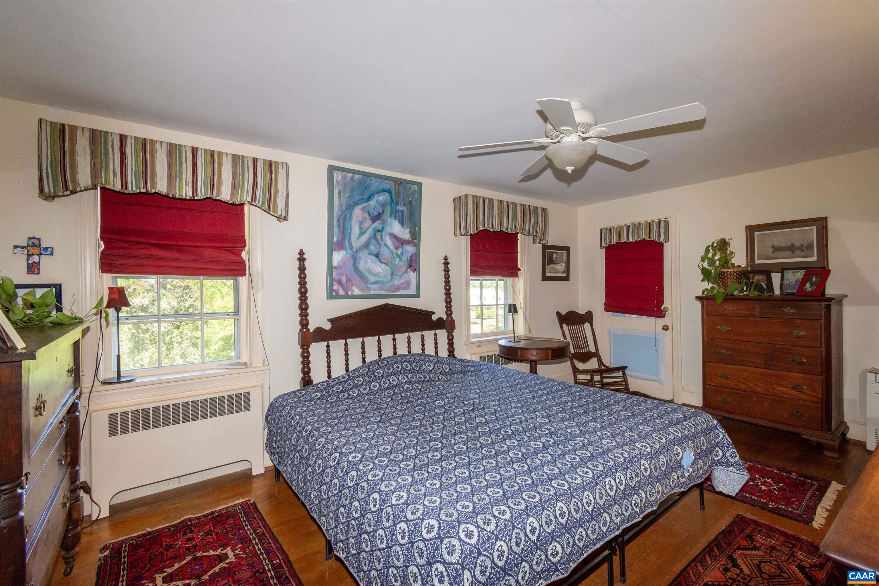 358 East Main Street Orange, VA 22960 - Photo 37 of 56 a bedroom with a bed a dresser and a window