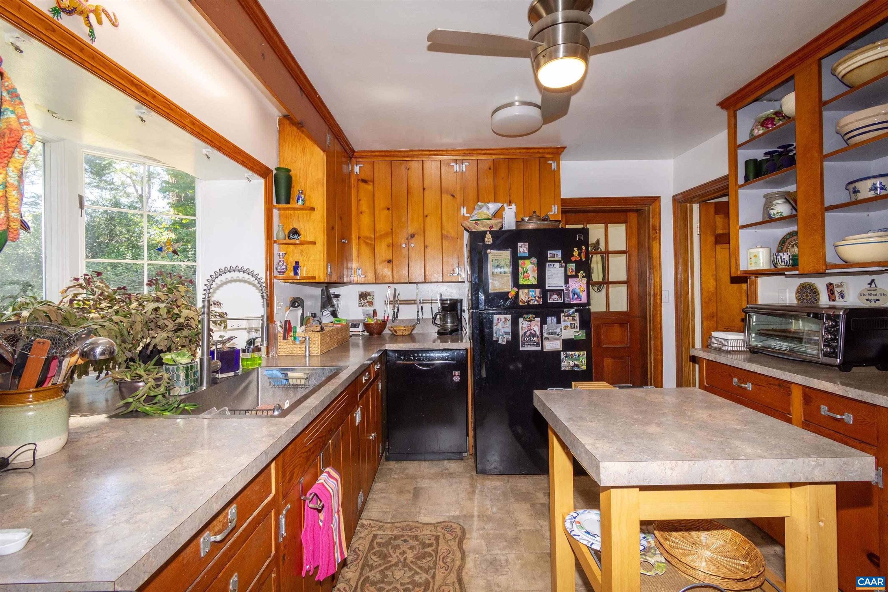 358 East Main Street Orange, VA 22960 - Photo 39 of 56 a kitchen with stainless steel appliances granite countertop sink stove and cabinets