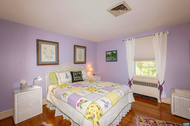 a bed room with a bed and a desk