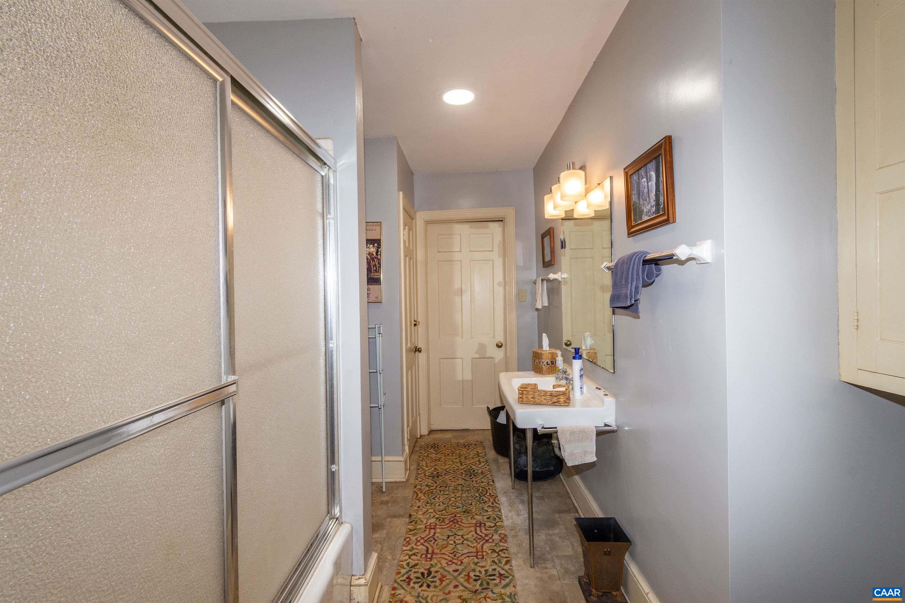 358 East Main Street Orange, VA 22960 - Photo 47 of 56 a bathroom with a sink toilet and shower