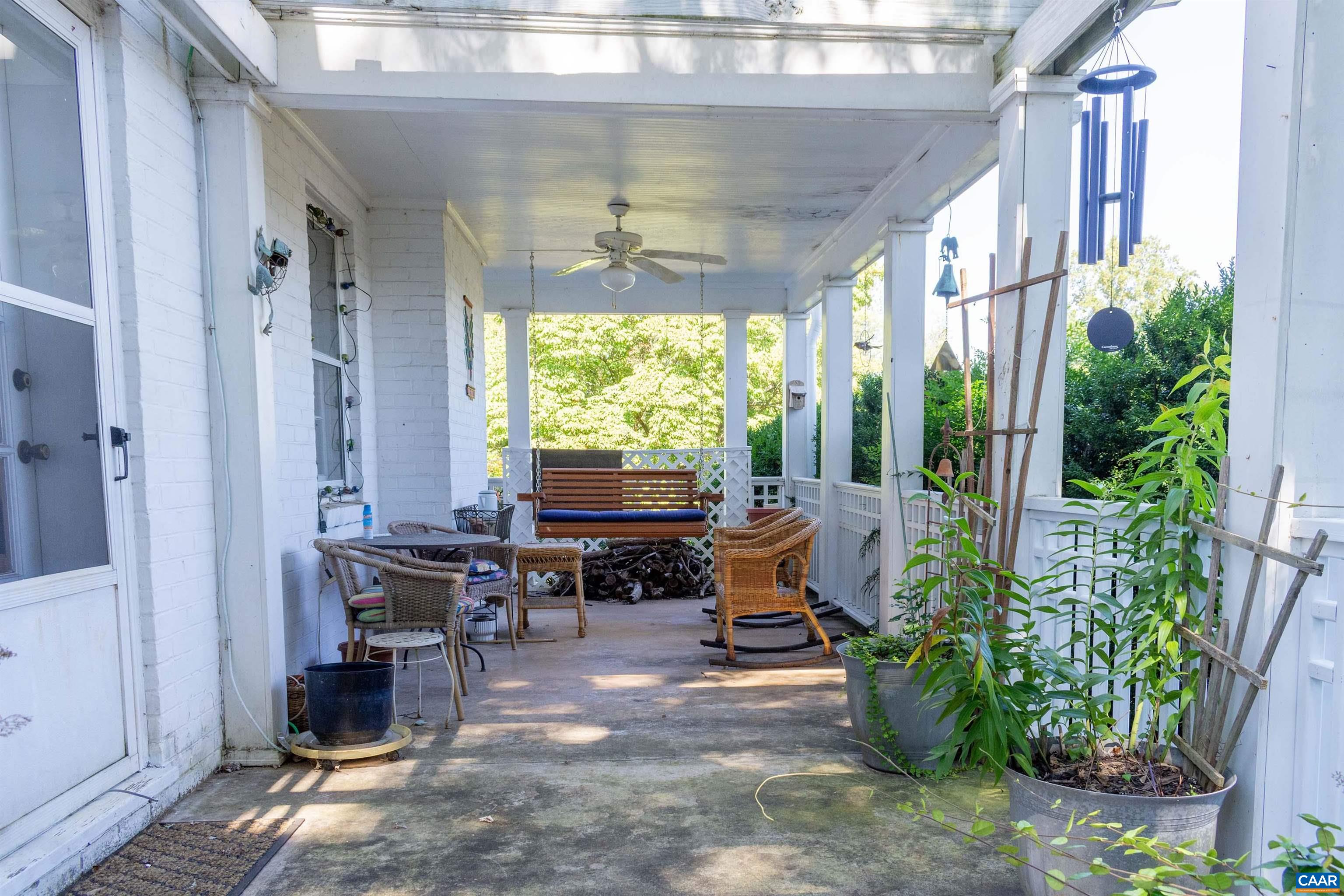 358 East Main Street Orange, VA 22960 - Photo 5 of 56 a outdoor living space with furniture and a potted plant