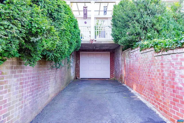 a kitchen with stainless steel appliances granite countertop a sink dishwasher and a stove with wooden floor