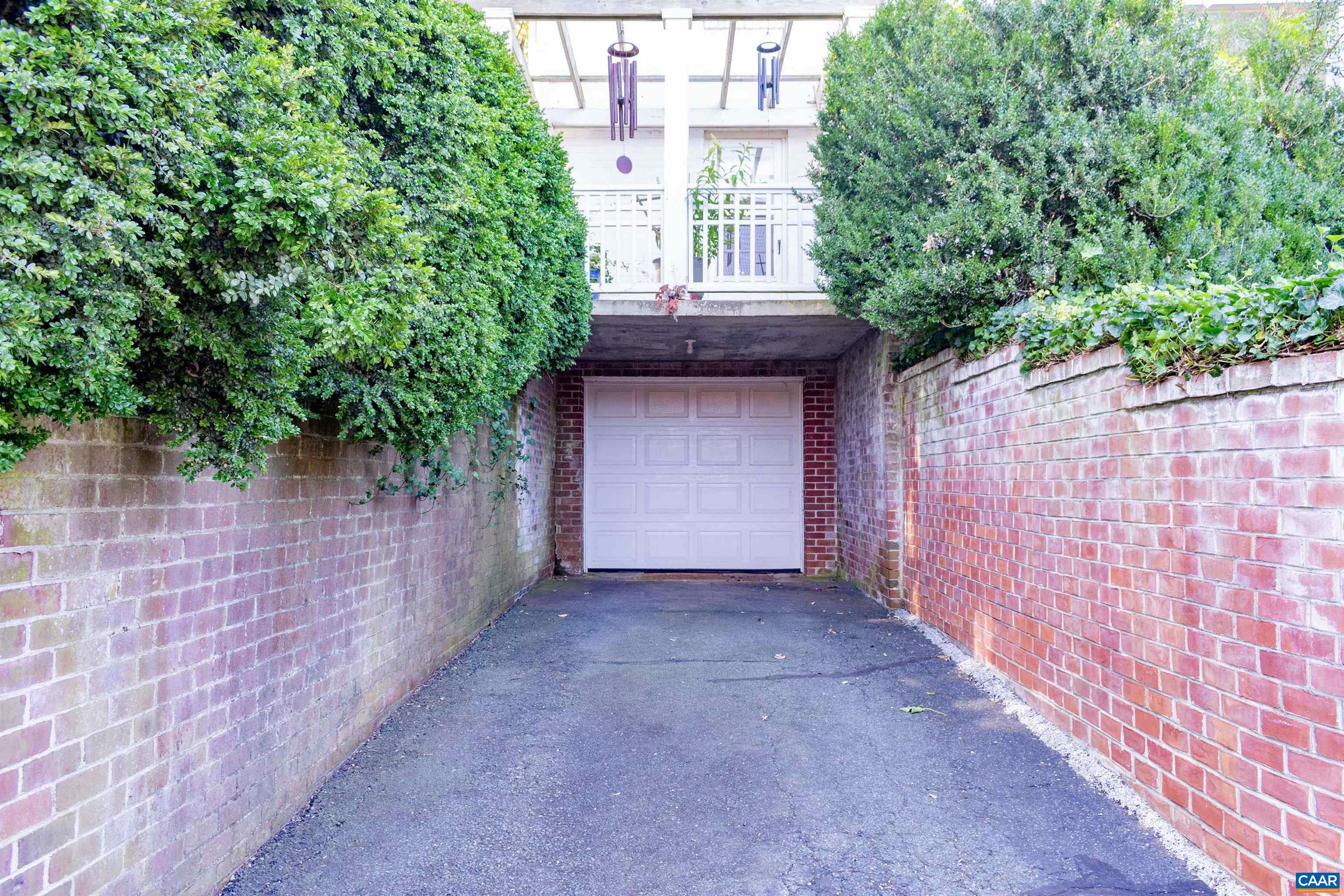 358 East Main Street Orange, VA 22960 - Photo 10 of 56 a view of a pathway of a building with an outdoor space