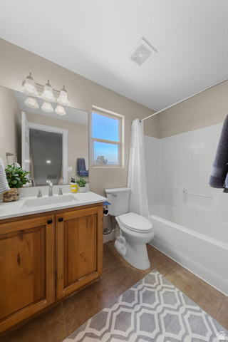 1570 South Rio Virgin Drive Washington, UT 84780 - Photo 62 of 71 Bathroom with shower / bathtub combination with curtain, vanity, and dark tile patterned flooring