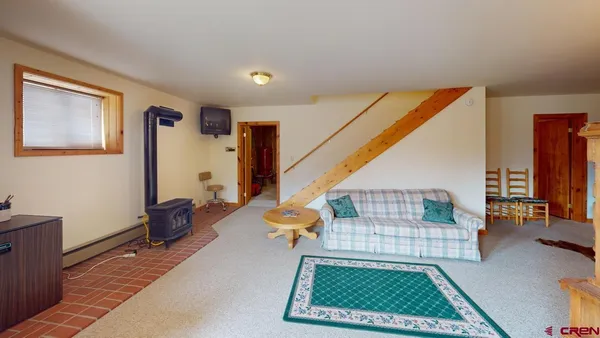 a view of a balcony with wooden floor and furniture