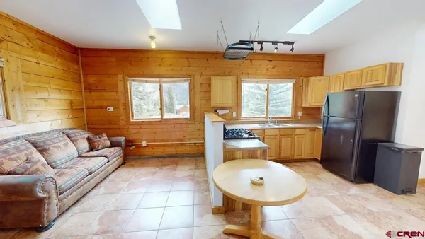 a view of empty room with wooden walls