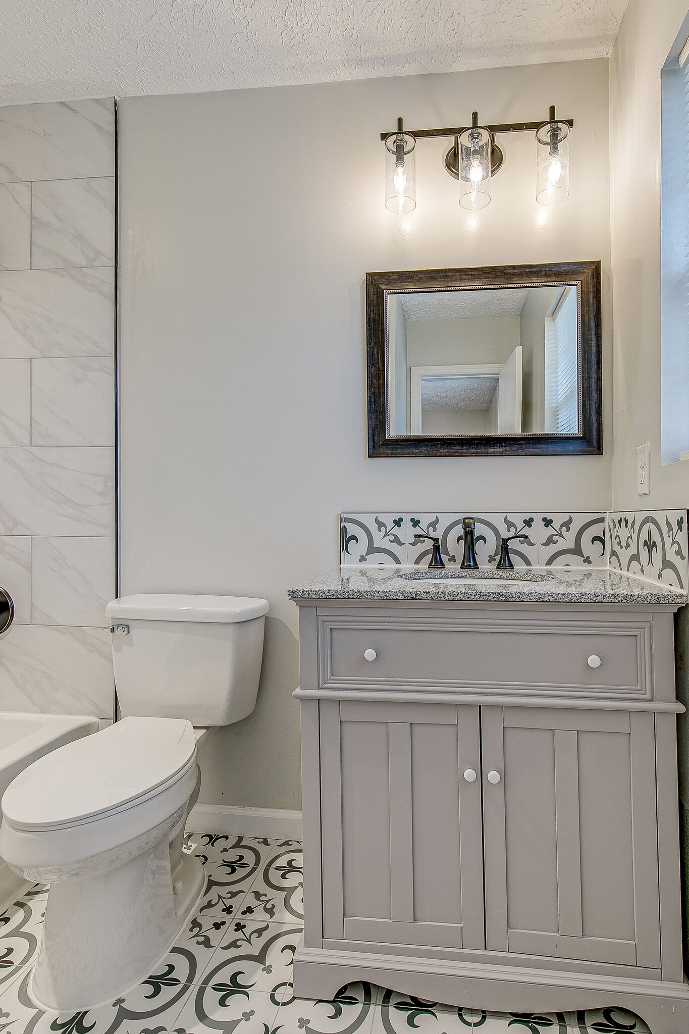 331 Alice Boynton Road Manchester, TN 37355 - Photo 14 of 22 a bathroom with a toilet a sink and mirror