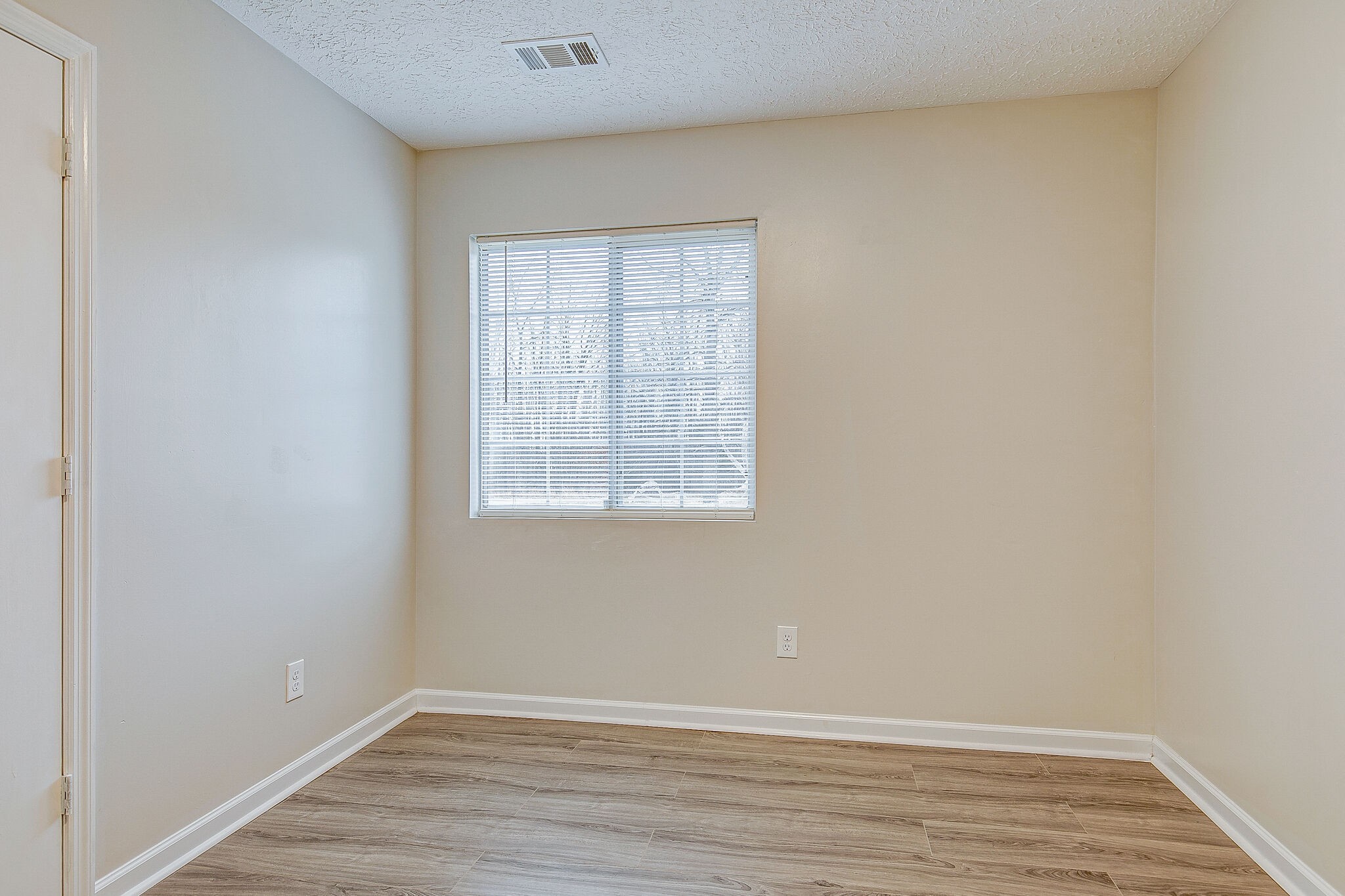 331 Alice Boynton Road Manchester, TN 37355 - Photo 16 of 22 an empty room with wooden floor and windows