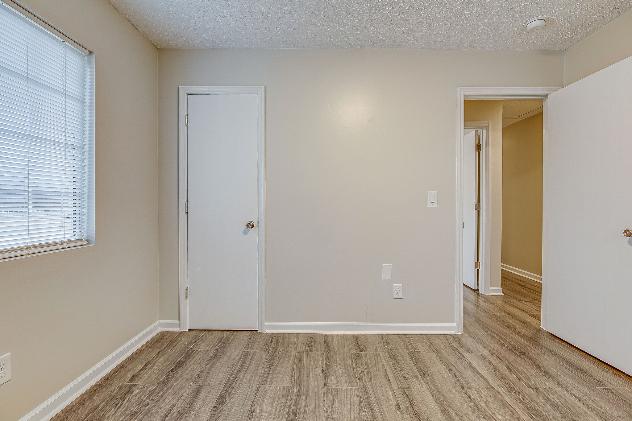 331 Alice Boynton Road Manchester, TN 37355 - Photo 17 of 22 a view of an empty room with wooden floor and a window